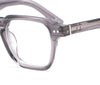 Close-up of a gray eyeglasses frame on a white background