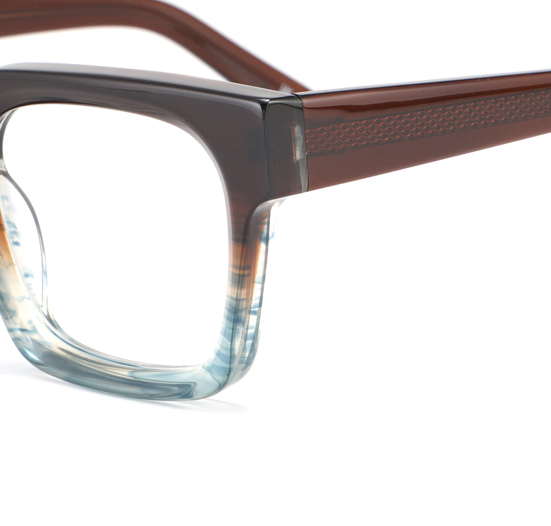 Close-up of a pair of eyeglasses with a brown frame and clear lenses on a white background.